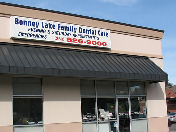 The exterior of Bonney Lake Family Dental Care with a sign: "Evening &amp; Saturday Appointments"